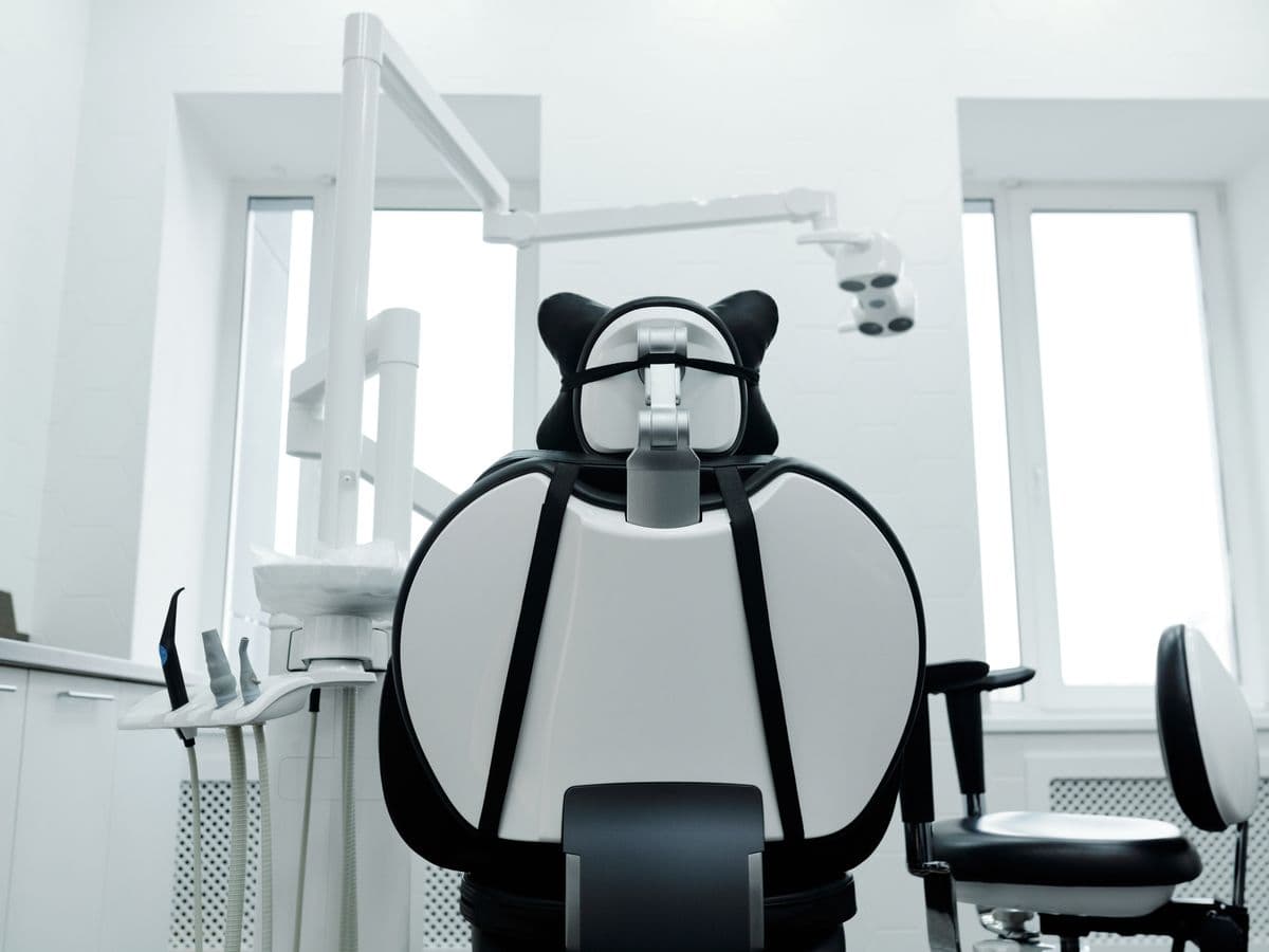 Modern dental operatory room with high-tech monitors and chair at City Dental & Face Hospital