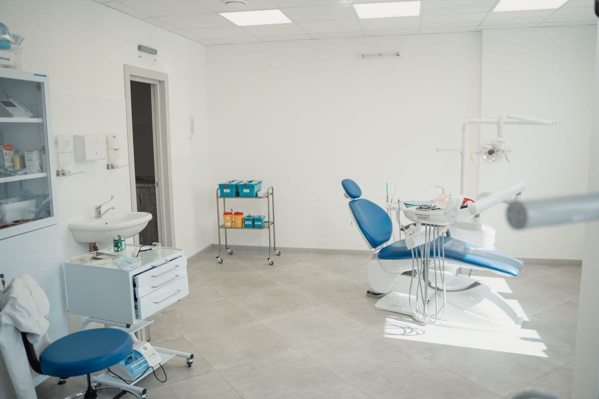 Bright and clean dental clinic lounge with dental chair